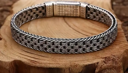 Close-up of BALI Bracelet’s eternal vine motif on clasp, showcasing silver and copper detailing