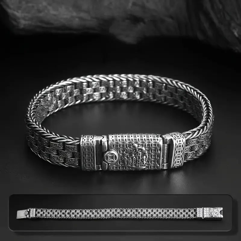 BALI Byzantine Chain Bracelet displayed on dark surface, highlighting intricate woven texture and engraved vine clasp