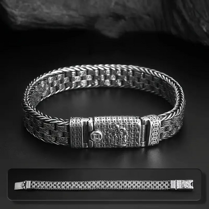 BALI Byzantine Chain Bracelet displayed on dark surface, highlighting intricate woven texture and engraved vine clasp