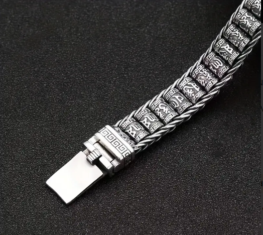 PATHFINDER Bracelet arranged in circular layout showcasing woven metal texture and spiritual clasp