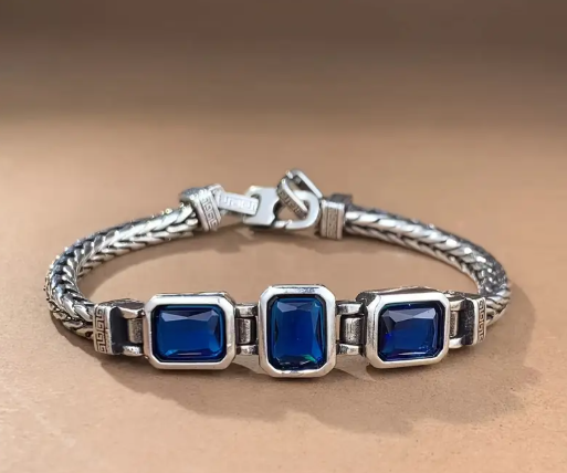 COBALT Handwoven Braided Bracelet with three cobalt-blue faux gemstones and silver-toned woven band
