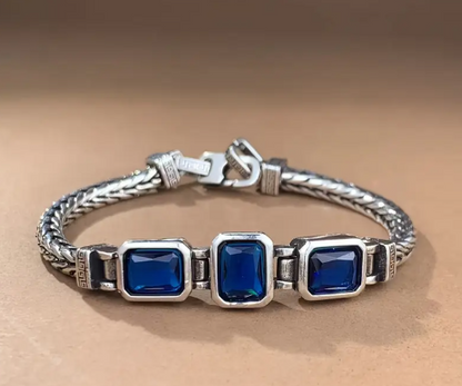 COBALT Handwoven Braided Bracelet with three cobalt-blue faux gemstones and silver-toned woven band