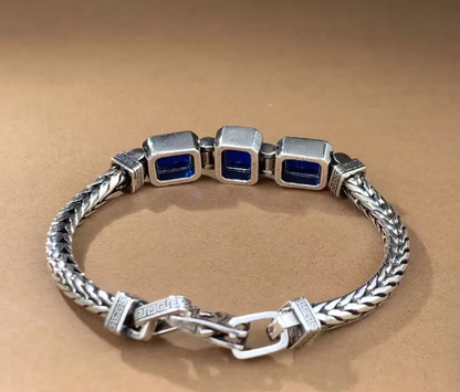 COBALT Bracelet styled on wrist, showcasing rich blue gemstone accents and masculine braided design