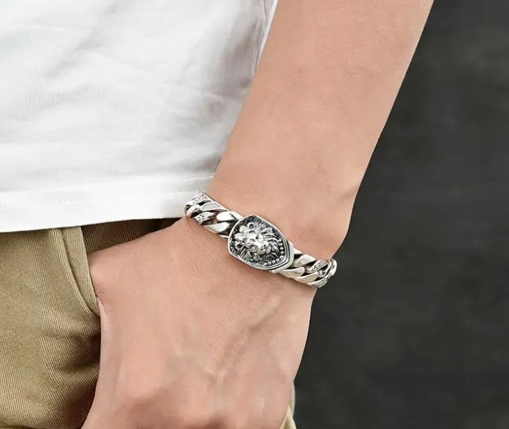 MEDICI Bracelet styled on wrist, showcasing heavy chain-link design and symbolic lion-head clasp for confident masculine look