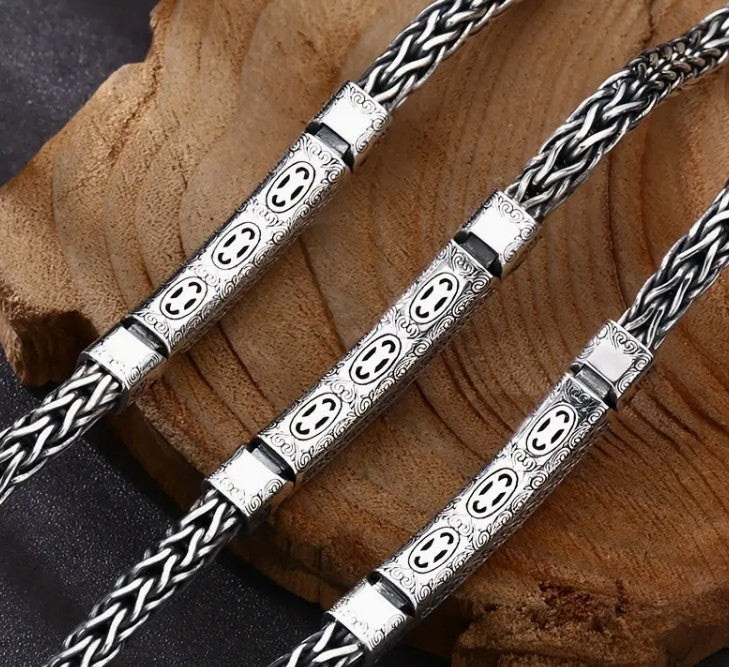 BRAZEN Braided Bracelet with electric blue zirconia stone and intricate metalwork, styled for bold masculine appeal