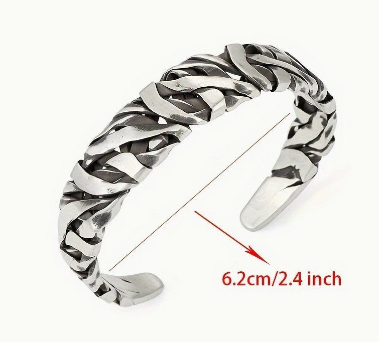 STRIKE Bracelet laid flat with 6.2cm diameter label, showing open-ended fit and striped silver detailing