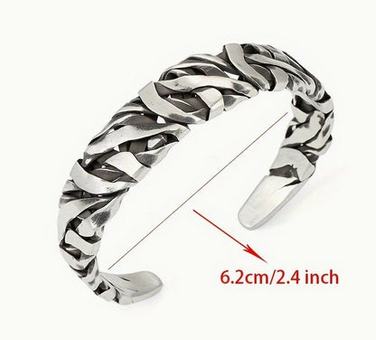 STRIKE Bracelet laid flat with 6.2cm diameter label, showing open-ended fit and striped silver detailing