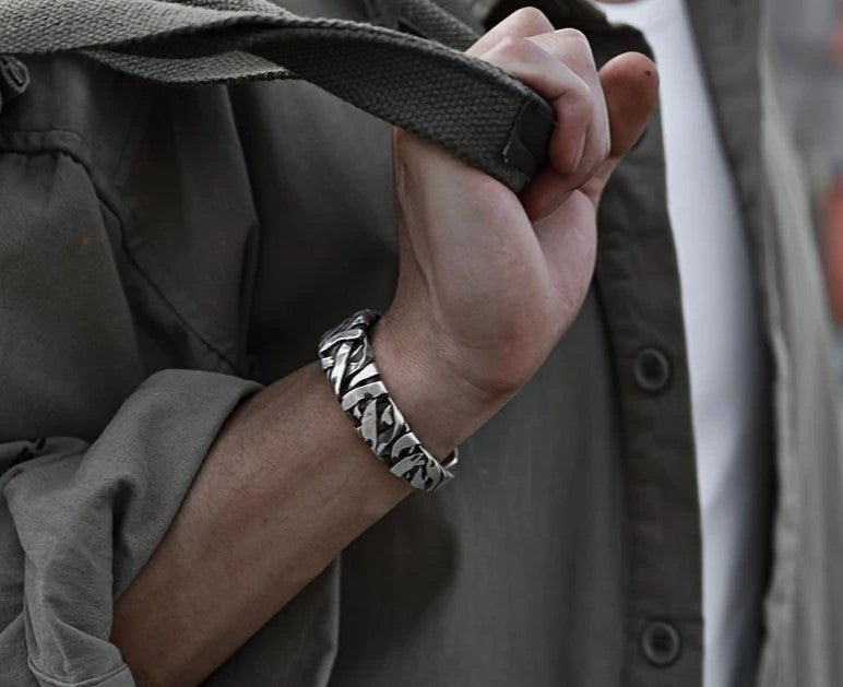 STRIKE Bracelet styled on wrist, emphasizing wide band and masculine vintage-inspired design