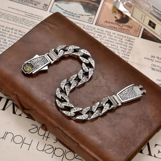 NEMEAN Bracelet worn on wrist, emphasizing bold design and luxurious silver-copper artistry