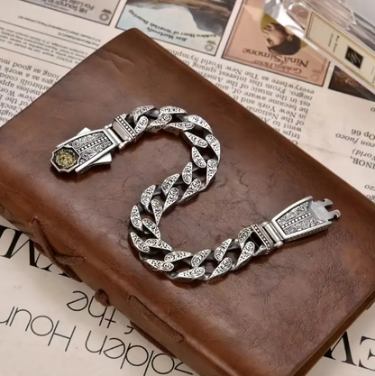 NEMEAN Bracelet worn on wrist, emphasizing bold design and luxurious silver-copper artistry