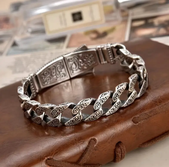 Angled view of NEMEAN Bracelet’s clasp and chain layout, capturing polished metalwork and secure fit