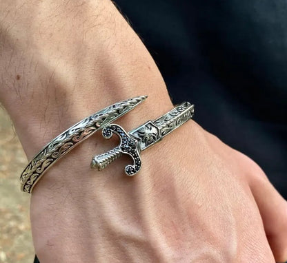 GLADIUS Sword Cuff Bracelet worn on wrist, showcasing detailed blade and hilt design with punk edge