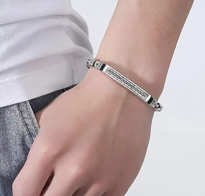 KIEL Bracelet worn on wrist, showcasing intricate woven chain and symbolic clasp design