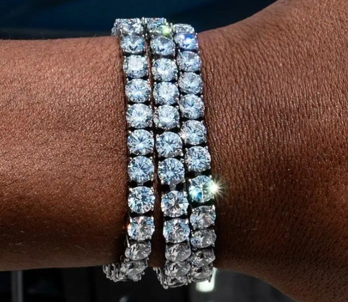 Close-up of wrist wearing two DSTONE Crystal Tennis Bracelets, highlighting bold 5mm zircon shine and streetwear-inspired look